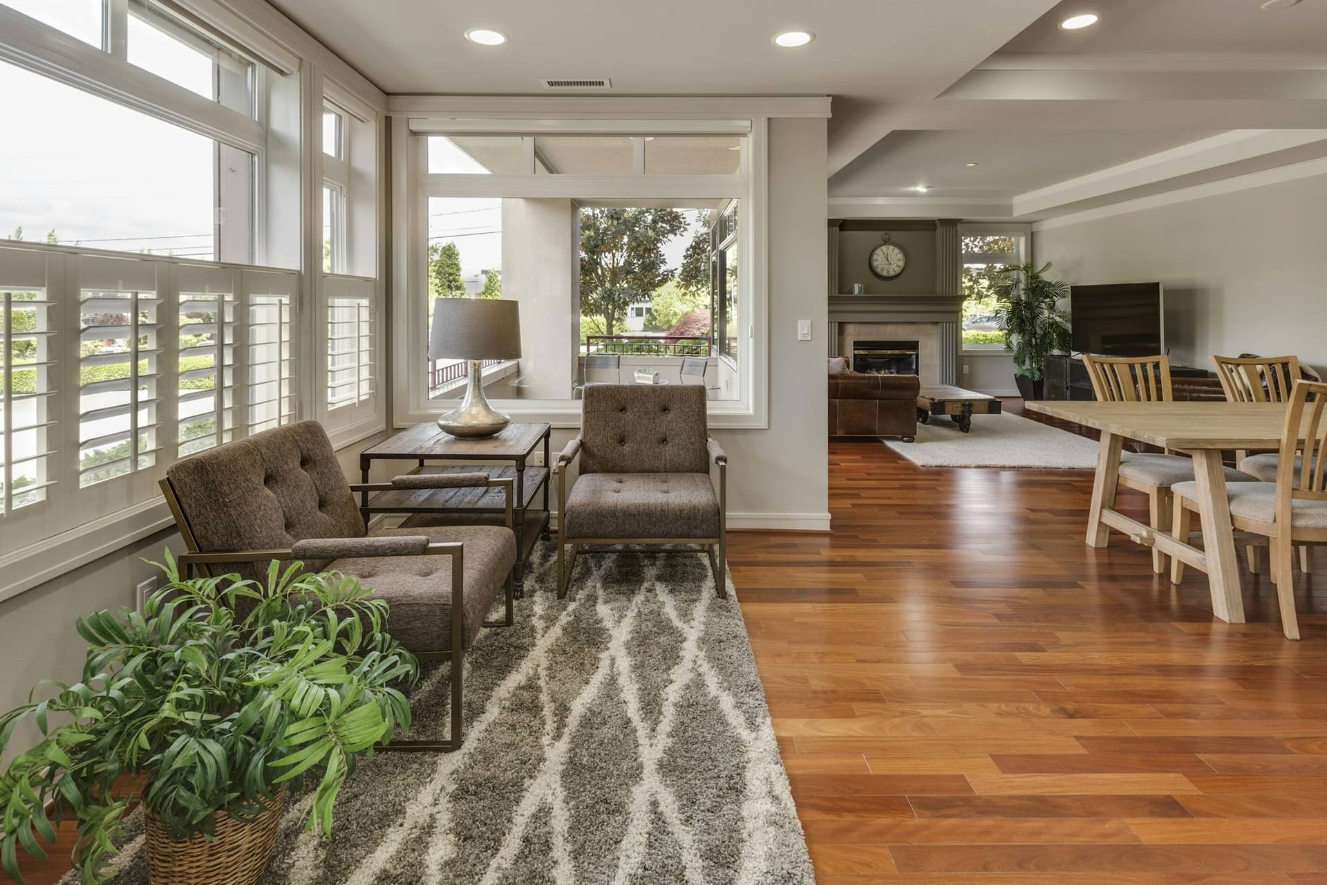 Sunny living and dining area with a warm wood floor