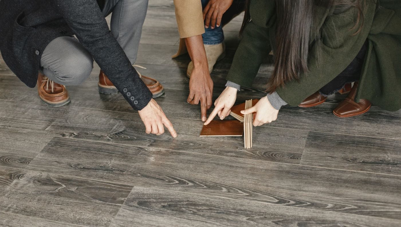 Comparing flooring samples before choosing one